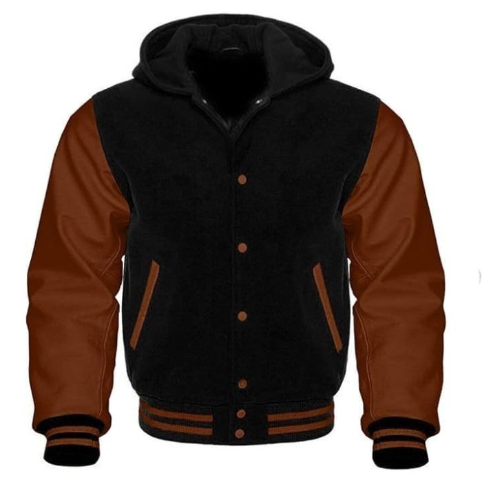 A black and brown varsity jacket with a hood, featuring a front pouch pocket and ribbed cuffs.