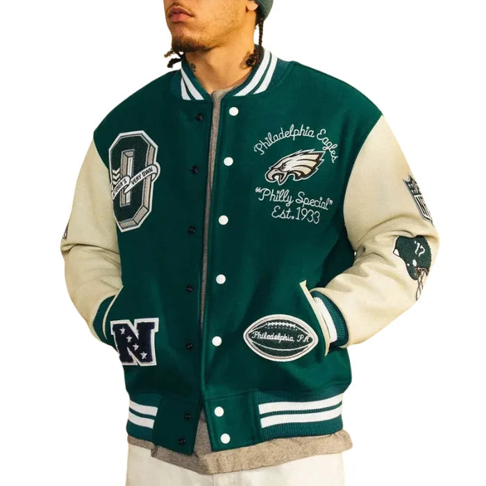 Green and beige varsity jacket with Philadelphia Eagles branding on a white background