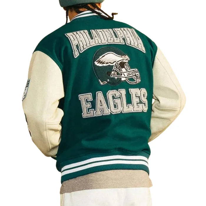 Green and beige letterman jacket with 'Philadelphia Eagles' text and logo on a white background