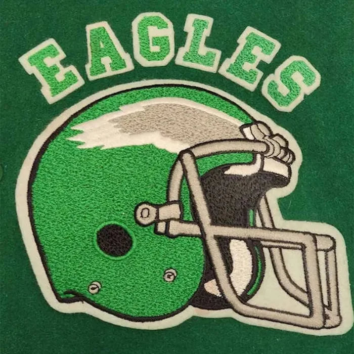 Embroidered patch of a football helmet with 'EAGLES' text on a green background
