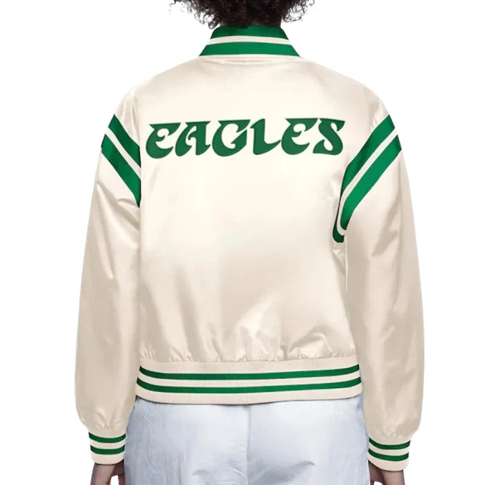 Beige jacket with green accents and 'EAGLES' text on a white background