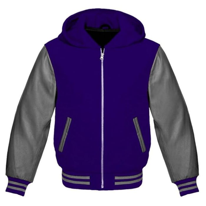 A royal blue zip-up hoodie with dark grey leather sleeves, featuring a full zipper closure, ribbed cotton cuffs, and a soft quilted fabric lining.