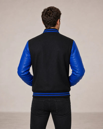 Men’s black and blue wool and leather varsity jacket back view