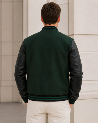 Back view of a blank men's black and green varsity jacket with black leather sleeves