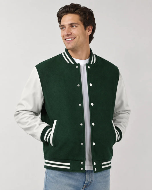 Mens green varsity jacket with wool body, white leather sleeves, snap buttons, and striped ribbed trim worn by male model
