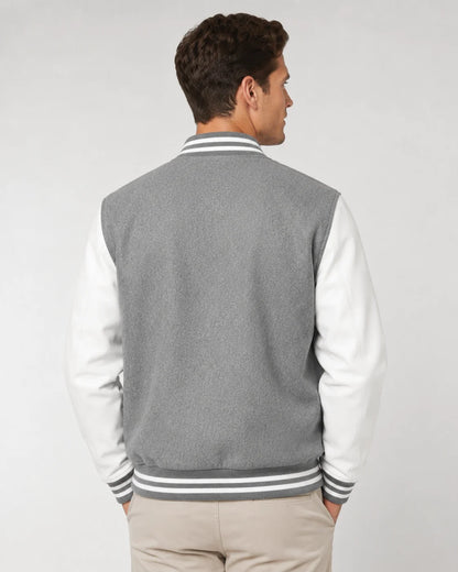 Back view of mens grey varsity jacket with blank grey wool body, white leather sleeves, and striped ribbed hem on male model