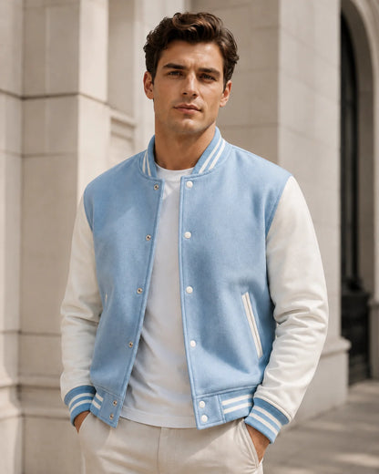 Men wearing a blank light blue varsity jacket with white leather sleeves, front view