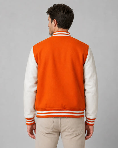 Back view of mens orange varsity jacket with blank orange wool body, white leather sleeves, and striped ribbed hem on male model