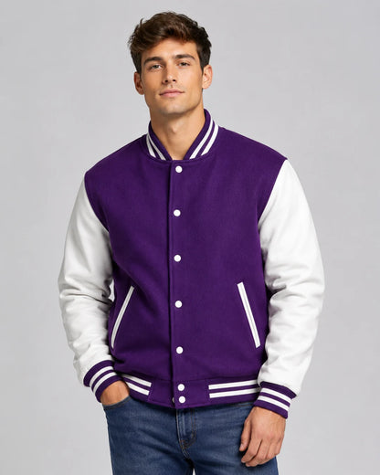Mens purple varsity jacket with wool body, white leather sleeves, snap buttons, and striped ribbed trim worn by male model