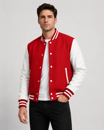 Mens red varsity jacket with wool body, white leather sleeves, snap buttons, and striped ribbed trim worn by male model