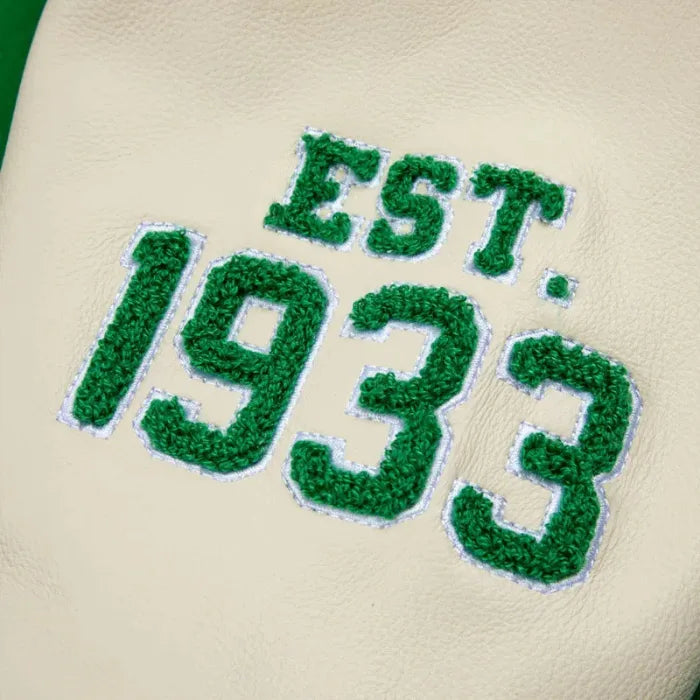 Green text 'EST. 1933' on a beige background