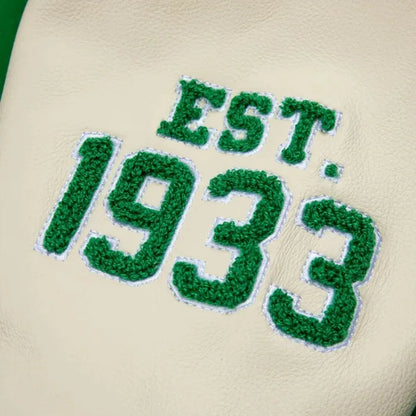 Green text 'EST. 1933' on a beige background