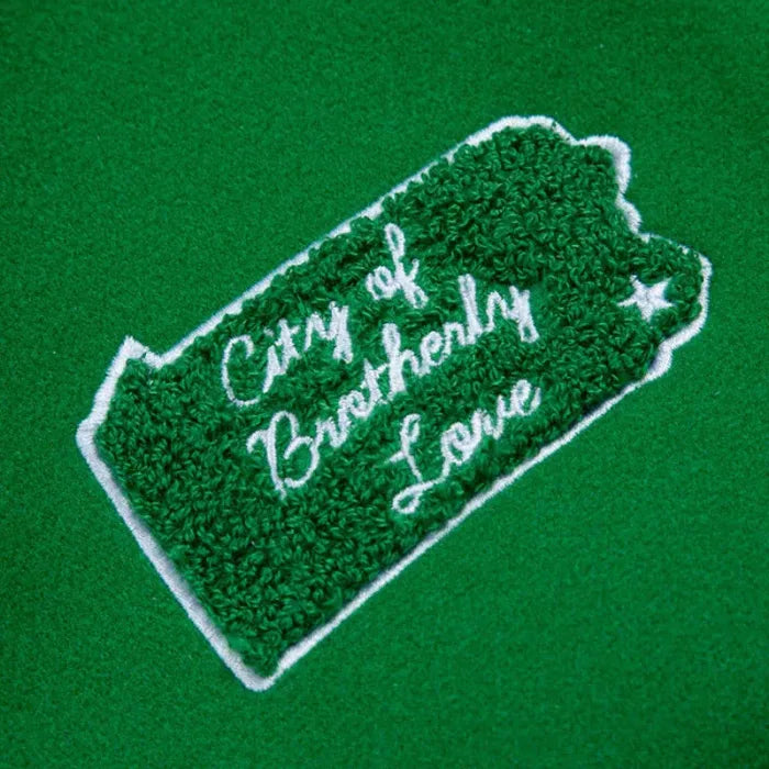 Embroidered patch with 'City of Brotherly Love' text on a green background