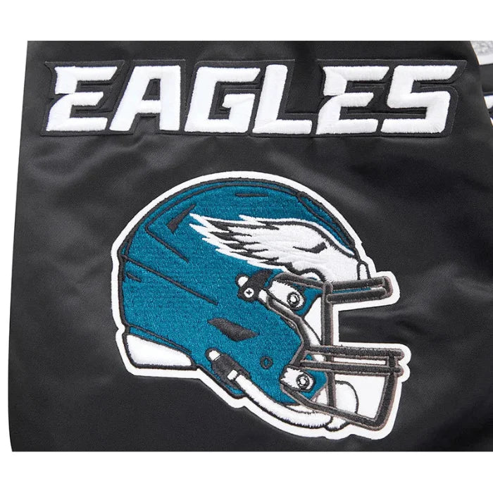 Black fabric with a blue helmet and 'EAGLES' text, likely related to the Philadelphia Eagles team.