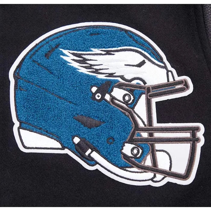 Blue football helmet with a white wing logo on a black background