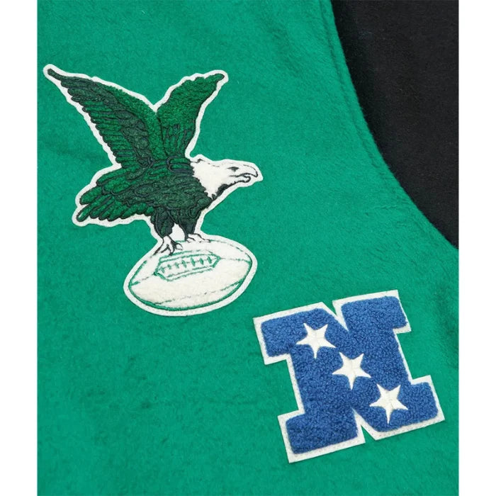 Green sports jersey with eagle logo and letter 'M' on a black background