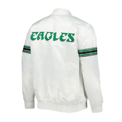 White jacket with 'EAGLES' text on the back, green and black stripes on sleeves, on a white background