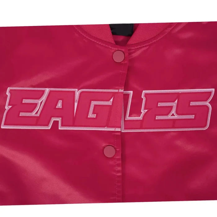 Close-up of a red jacket with 'EAGLES' embroidered on it.