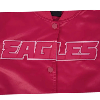 Close-up of a red jacket with 'EAGLES' embroidered on it.