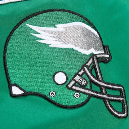 Embroidered football helmet patch on a green background