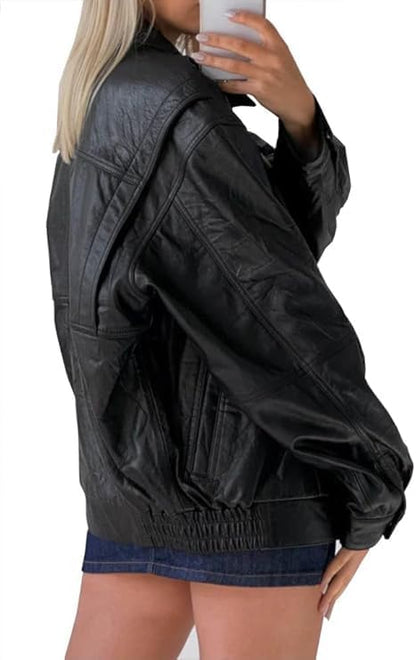 Black leather jacket worn by a person on a white background